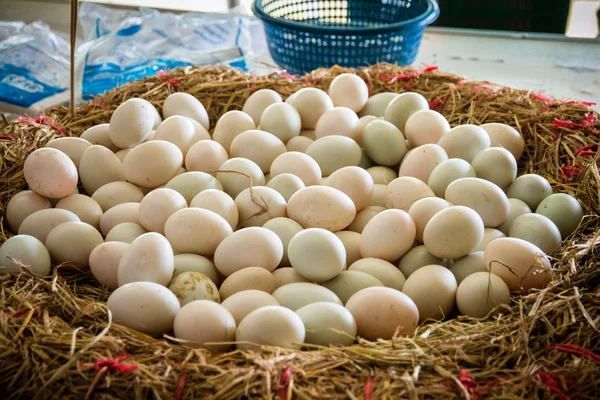 Duck eggs in the basket on the market.