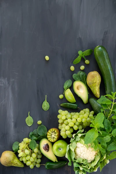 All green Vegetables and Fruits on Dark Background