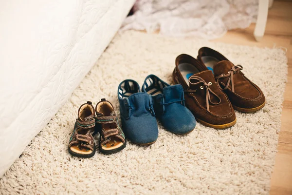 Family shoes on the carpet