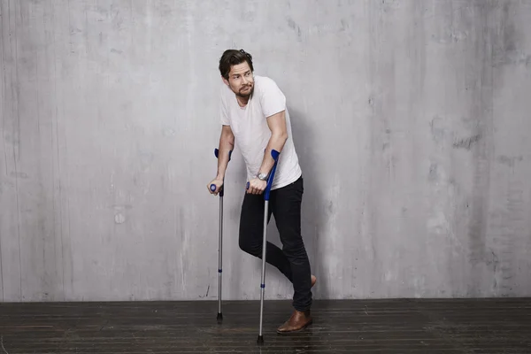 Young man on crutches
