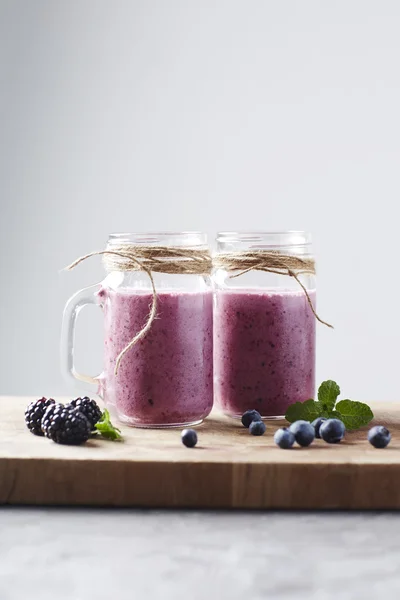 Jars with fruit smoothie