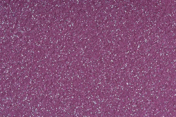 Purple glitter for texture or background.  Low contrast photo.