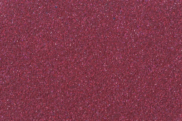 Crimson glitter background texture.  Low contrast photo.