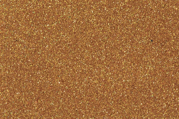 Gold glitter background.  Low contrast photo.