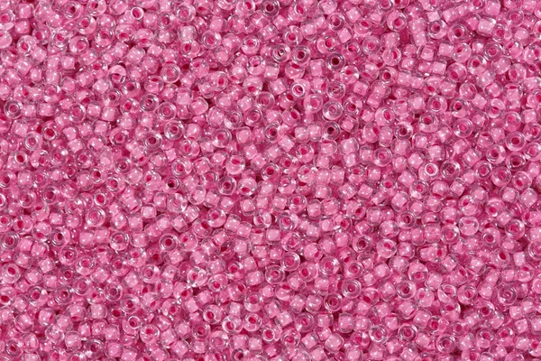 Pink glass beads. Abstract texture.