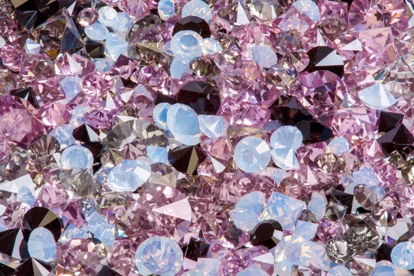Many small diamond jewel stones, luxury background closeup