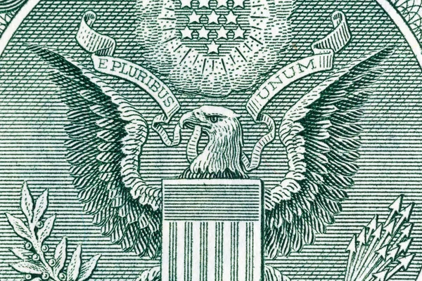 Eagle on one U.S. dollar bill, close-up photo.