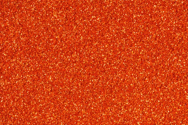 Orange glitter sparkle. Background for your design.