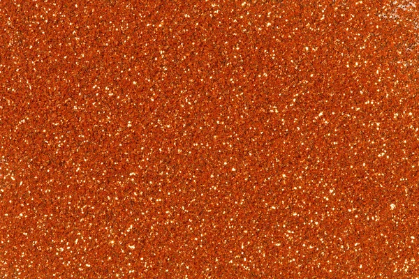 Orange glitter texture christmas background.