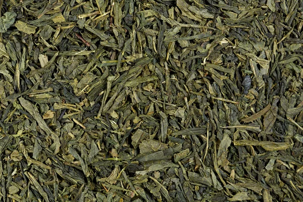Close up of green tea leaflets, detail, macro, full frame, horiz