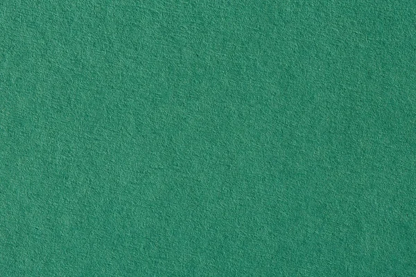 Green paper background, colorful paper texture.