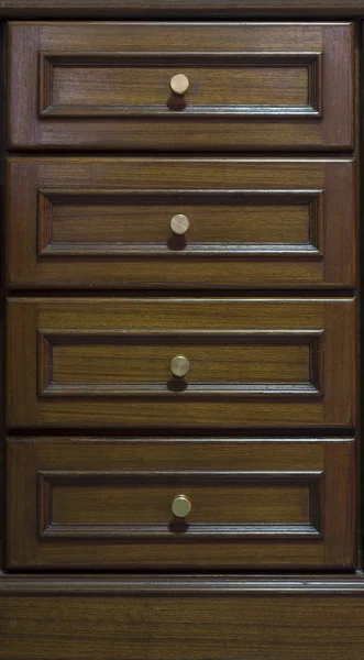 Cabinet with drawers made from dark wood