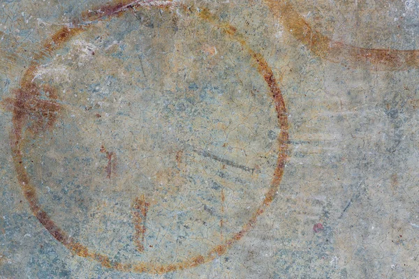 Grunge brown rust stains on polished old grey concrete floor.