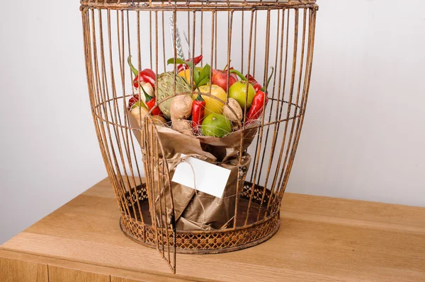 The original unusual edible vegetable and fruit bouquet  with card in bird cage