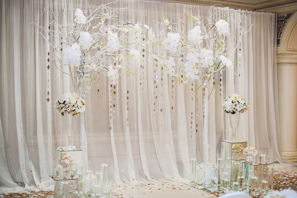 Beautiful wedding ceremony design decoration elements with arch, floral design, flowers, chairs