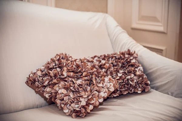 Decorative pillows with a pattern on  big sofa