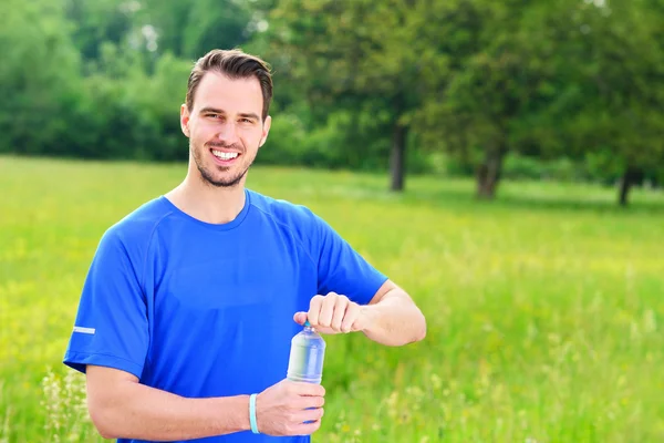 Man drinking water from bottle