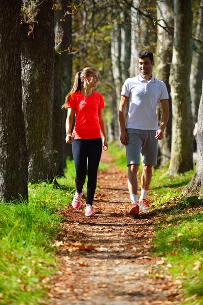 Young couple jogging in park