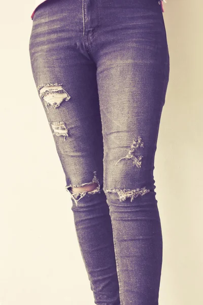Female wearing jeans vintage tone background