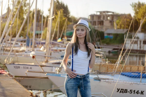 Nikopol, Ukraine, 08.09.2015. The beautiful girl on walk on the yacht club mooring