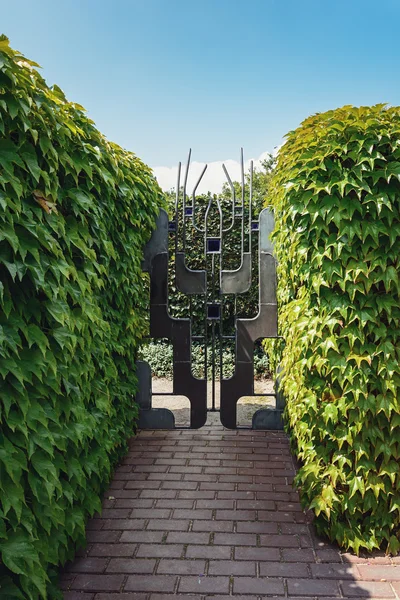 Decorative wrought-iron gate in the garden.