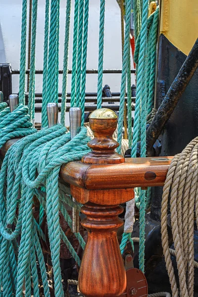 Blue hanged ship rope aboard a sailing ship