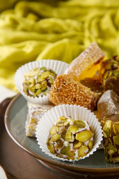 Eastern sweets. Turkish delight with pistachios in a vase. The f