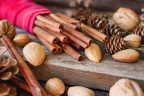 Christmas mood. cinnamon, walnuts and pine cone