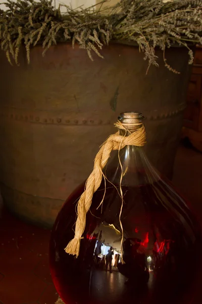 Glass jar with red wine