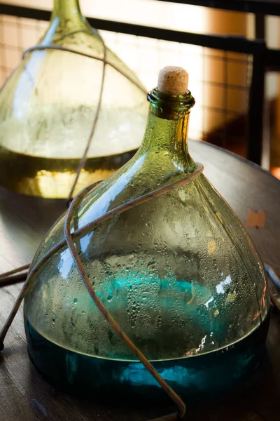 Glass jar with colored water solution