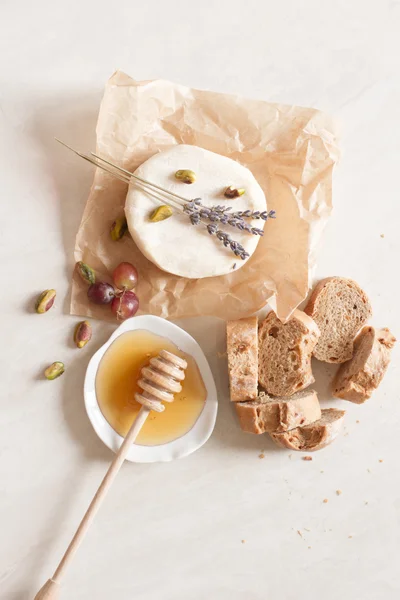 Appetizer wine cheese bread and honey