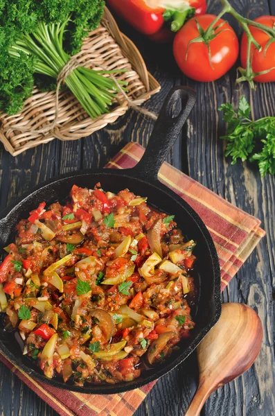 Vegetable ratatouille baked in cast iron frying pan