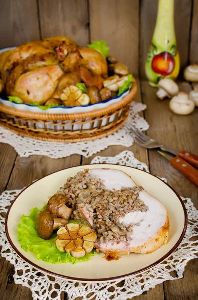 Portion of chicken stuffed with buckwheat with mushrooms