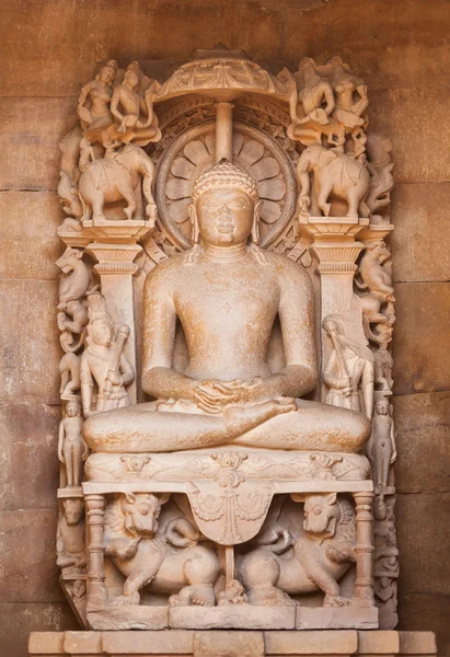 The Jain's statue on a throne made of sandstone.