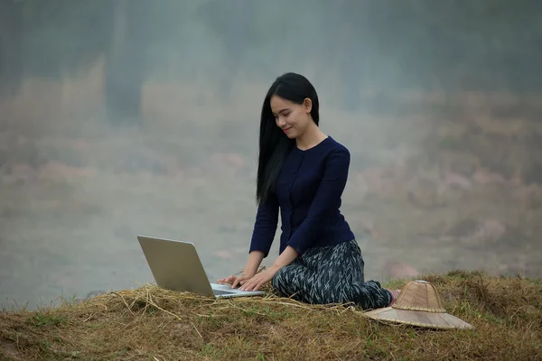 Woman computer on the countryside