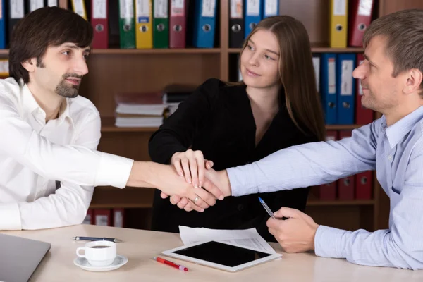 Group of young Business People shaking Hands