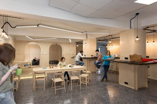 College Campus Kitchenette Area and Young People around