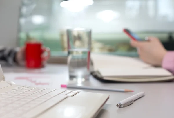 Office Life Concept - Computer Glass of Water and Stationery