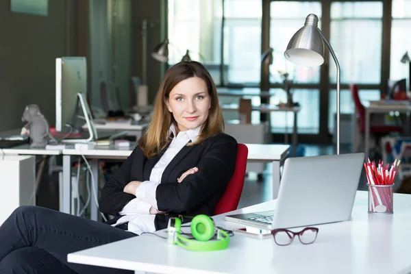 Charismatic Business Lady in official clothing in contemporary Office Interior