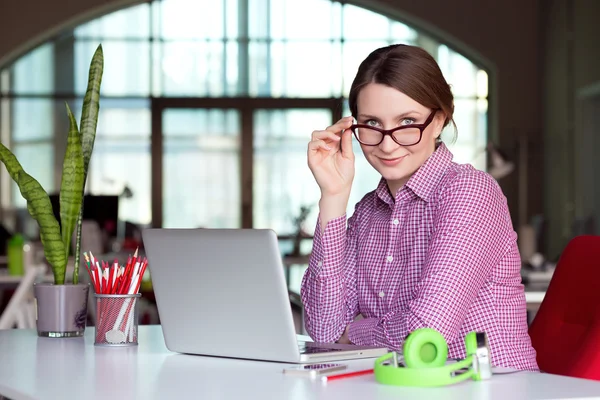 Shrewd female Manager in modern Digital Office Interior