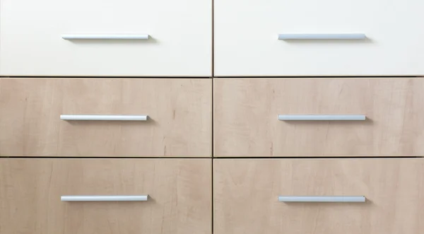 Cropped cabinet with six symmetric drawers
