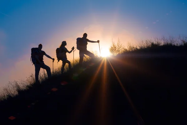 Three people family silhouettes on vacation