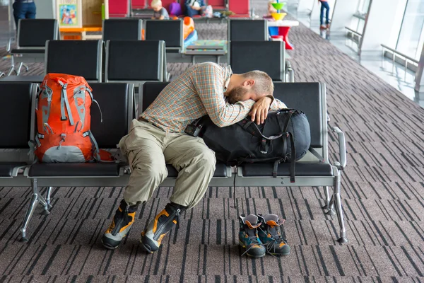 Airport lounge and people waiting for boarding