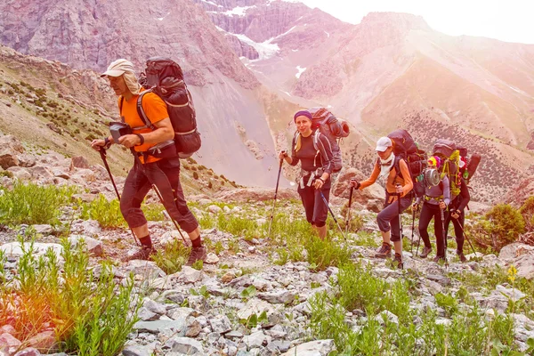 People traveling in mountains