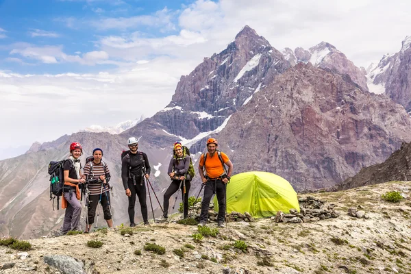 Alpine climbers team and camp