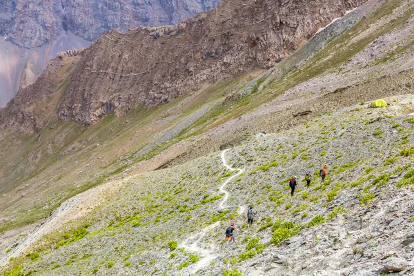 White mountain footpath and group of hikers