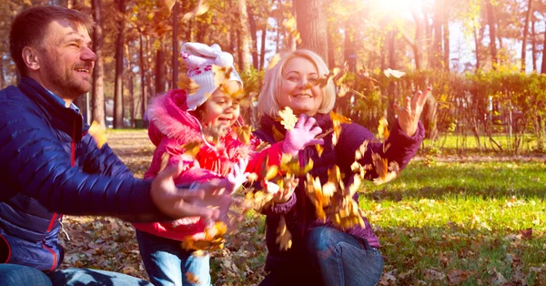 Carefree European Family Playing in Autumnal Park