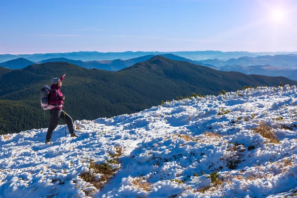 One Hiker Walking on Snow and Ice Terrain Wide Mountain View