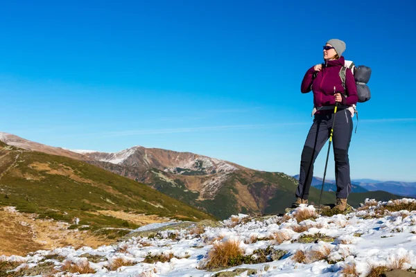 Female Hiker Staying on Mountain Trail and Enjoying Nature