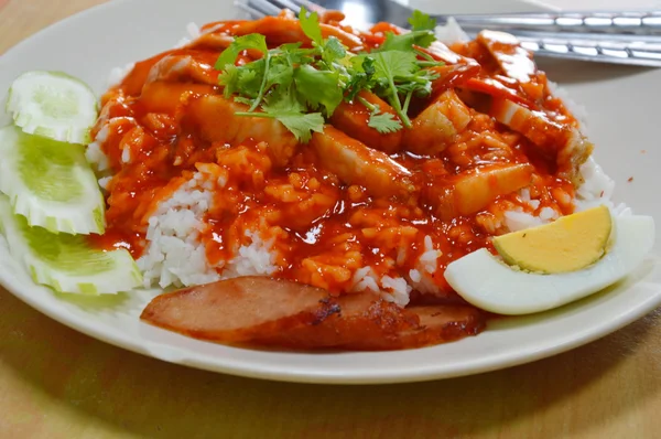 Barbeque pork on rice and dressing with red sweet sauce
